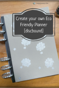A discbound planner with clouds dawn on the cover. The title says. - create your own eco friendly planner [discbound]
