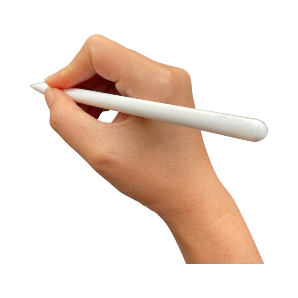 Picture of a woman’s hand holding an apple pencil. part of an article a beginners guide to digital planning on ipad.