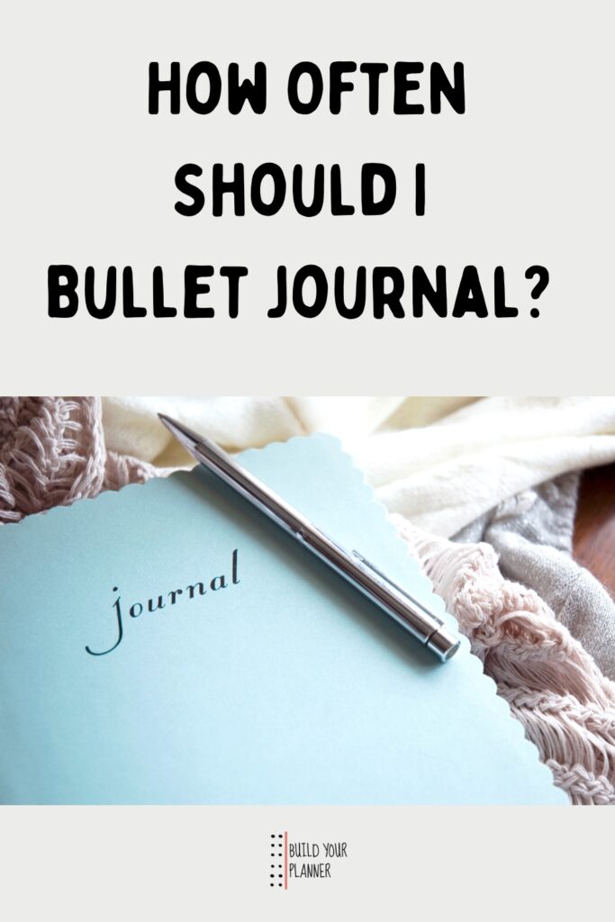 Picture of a journal and pen set on some blankets. The title reads - how often should I bullet journal?
