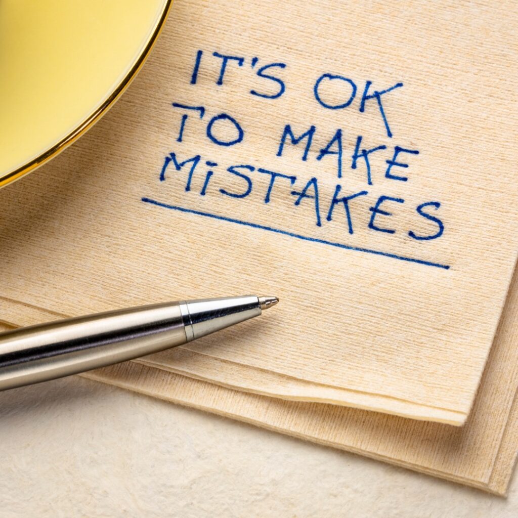 Picture of a napkin that has been written on with a pen. It says ‘it’s ok to make mistakes’