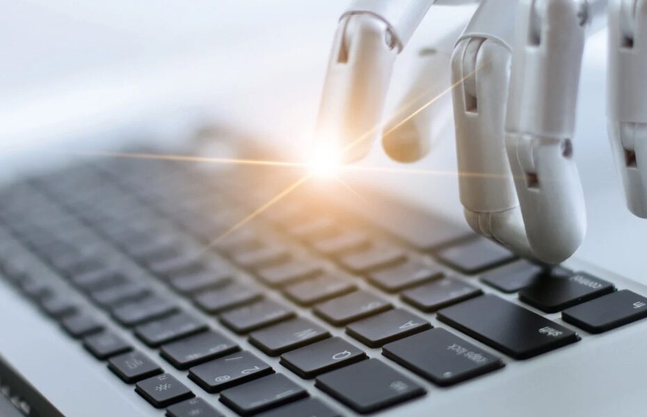 Picture of a robot hand pressing a button on a laptop. Part of an article - can chat gpt organize your life?